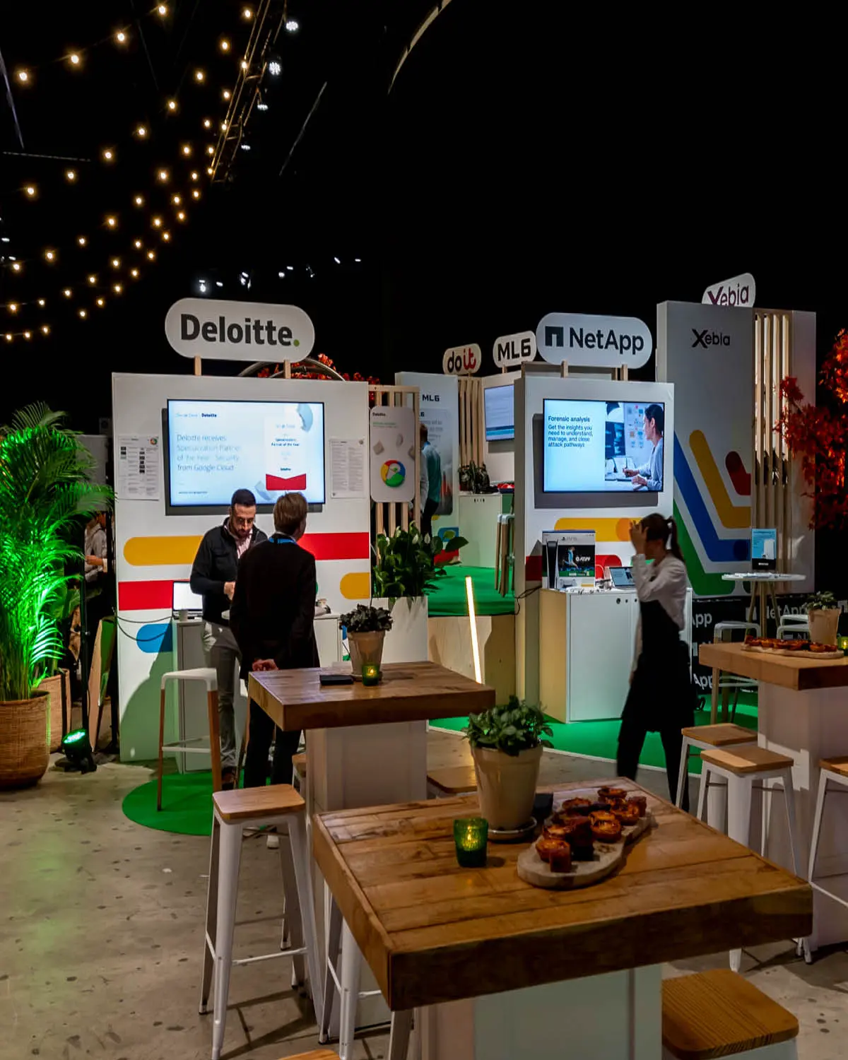 Branded sponsor booth at a corporate event — modular structure with counter and brand-accurate finishing by BrandYourEvent
